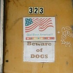 fredhatt-2002-06-god-bless-america-beware-of-dogs